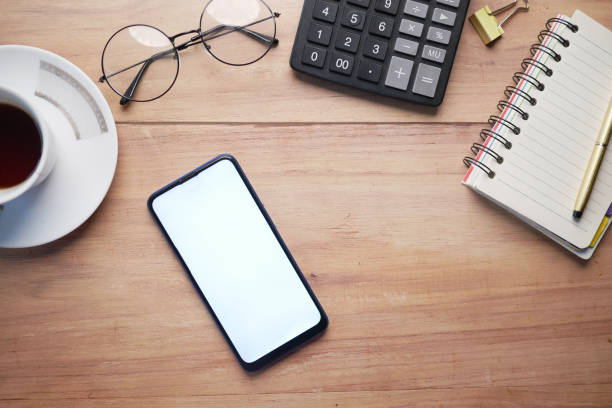istock top view of smart phone, calculator and notepad on table 1328108495