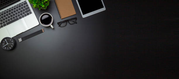 istock Workspace - Flat top view illustration of a workspace with a coffee cup and notebook on the black desk surface,Office desk concept. 1328110157