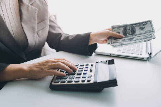 istock Male hand putting coins with money stack step growing growth and dollar bag. saving money, Concept finance business investment. 1328112545