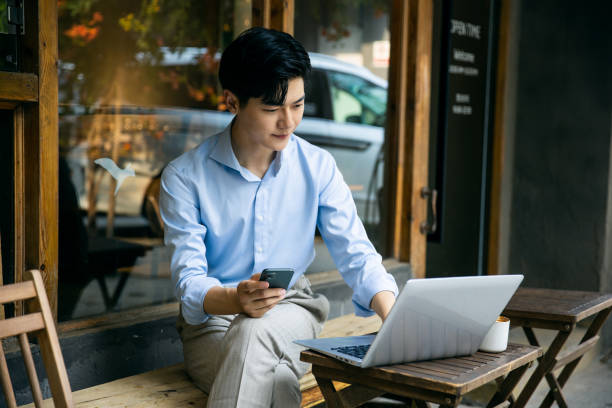istock Asian businessman working on laptop 1328115975