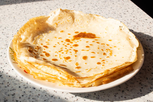 istock Large round pancakes on a plate on the table 1328118154