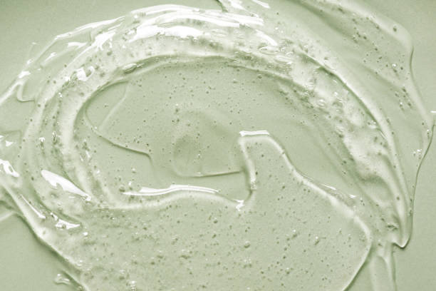 istock Cosmetic gel texture on green 1328120123