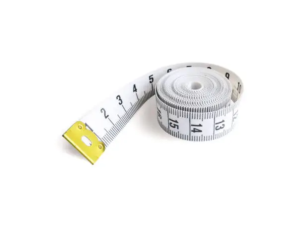 Rolling white PVC measuring tape with one twi three four five centrimeter scale nummber staring edge