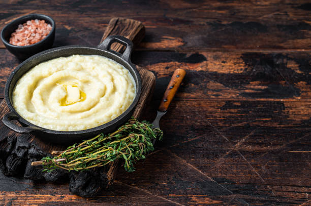 istock Mashed potatoes in a pan on wooden rustic table. Wooden background. Top view. Copy space 1328126057