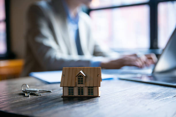 istock Real estate sales at working 1328126742