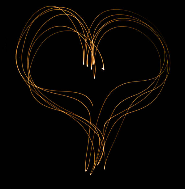 istock light trail heart in orange 1328127462