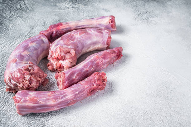 istock Raw Turkey neck meat on a butcher table. White background. Top View. Copy space 1328127592