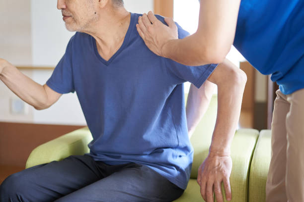 istock Caregiver assisting the elderly 1328128327