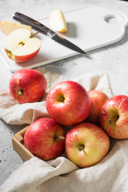 istock Apples in a basket on a gray background. Autumn harvest 1328130708