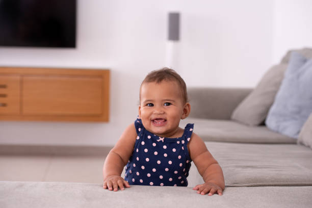 istock Adorable baby leaning on the sofa. 1328135279