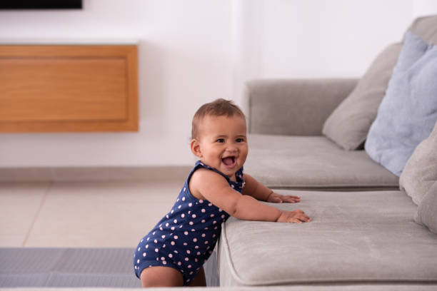 istock Adorable baby leaning on the sofa. 1328135378