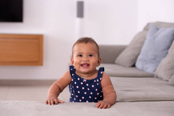 istock Adorable baby leaning on the sofa. 1328135549