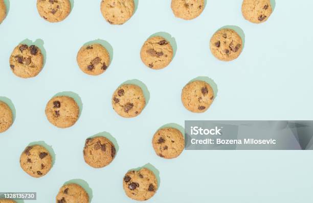 Chocolate Chip Cookies Arranged In A Pattern On A Turquoise Background Sweet Food Concept With Copy Space Stock Photo - Download Image Now