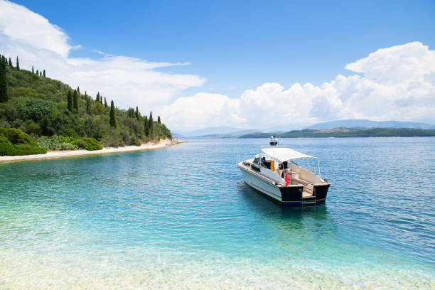 Motorboat yacht in a sea, yachting, sailing, travel and active lifestyle concept. Corfu island, Greece