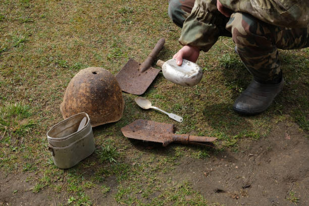 istock Old rusty helmet, shovels, aluminum flask, spoon. 1328138674