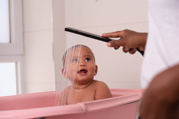 istock Little baby girl bathing. 1328142311
