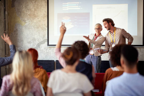 istock Presentation participants in the conference room are asking questions 1328143055