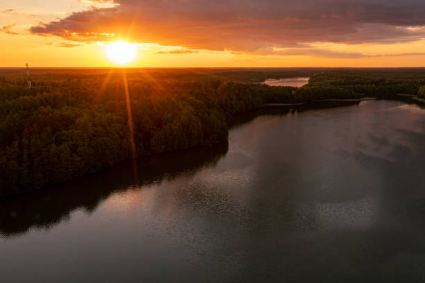 istock Golden sunset over lake, drone view 1328146030