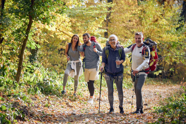 istock Couples in good mood enjoying beautiful sight while hiking 1328146031
