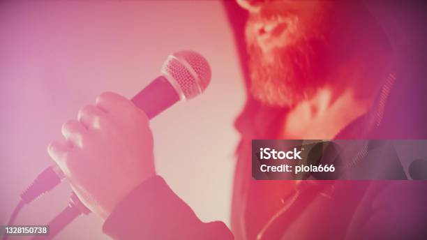 Rock Singer Screaming In A Live Show With Stage Lights Stock Photo - Download Image Now
