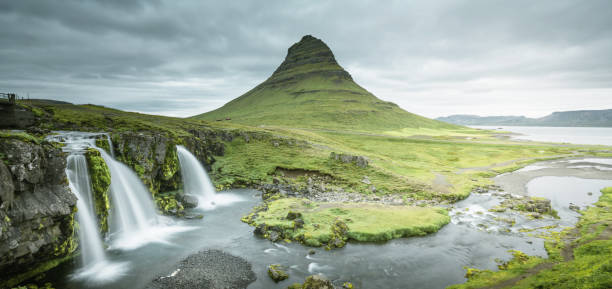 istock Kirkjufellsfoss Waterfall and Kirkjufell mountain 1328150894