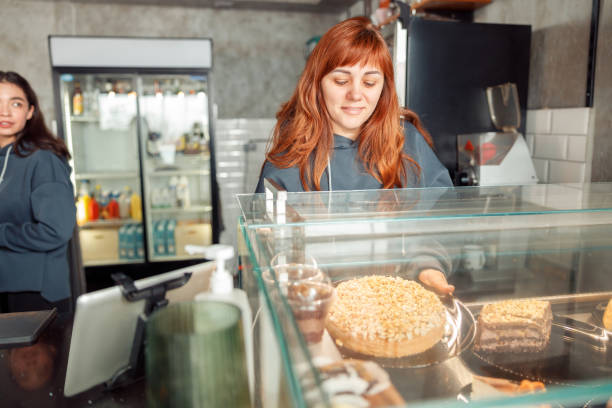 istock Happy smiling professional barista in cafe 1328152561