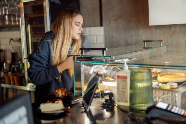 istock Happy smiling professional barista in cafe 1328152585