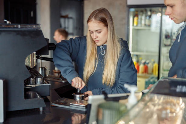 istock Happy smiling professional barista in cafe 1328152590