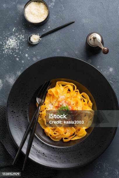 Fettuccine Pasta With Traditional Italian Passat Sauce And Parmesan Cheese In Light Plate On Old White Concrete Background Top View Stock Photo - Download Image Now