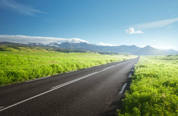 istock road in summer sunny Iceland 1328153763