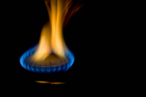 istock Flame of a gas burner on a black background 1328155385