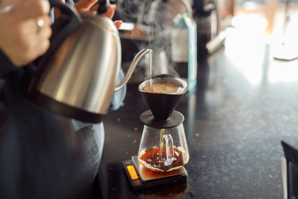 istock Happy smiling professional barista in cafe 1328155434