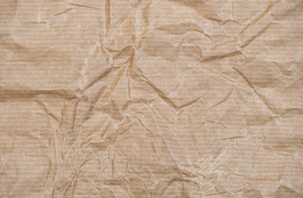 istock Recycled crumpled paper texture. Craft cardboard background 1328156393
