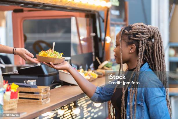 Satisfied Afro American Woman Getting Fast Food Tray With Delicious Nachos Stock Photo - Download Image Now