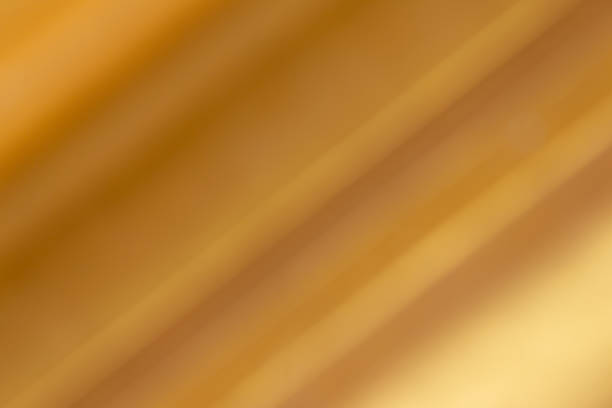 istock Metallic gold background image. (oblique gradient) The light reflected on the gold foil. 1328158802