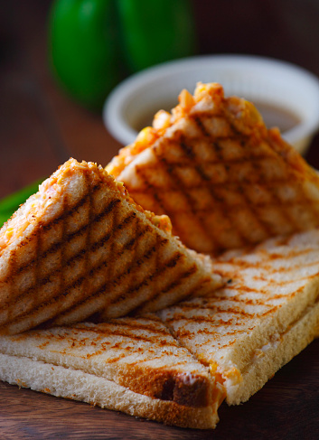 Veg grilled sandwich served with ketchup, selective focus