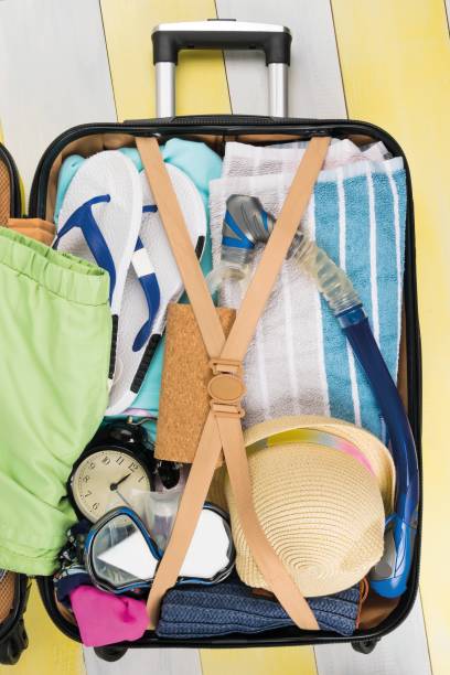 istock things for summer holidays and travel to warm countries inside a suitcase 1328166084