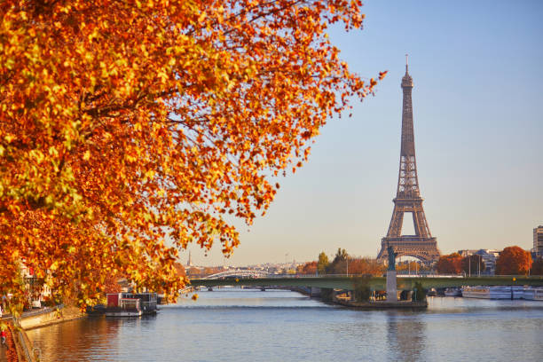Scenic view of the Eiffel tower over the river Seine from Mirabeau bridge on a bright fall day in Paris stock photo