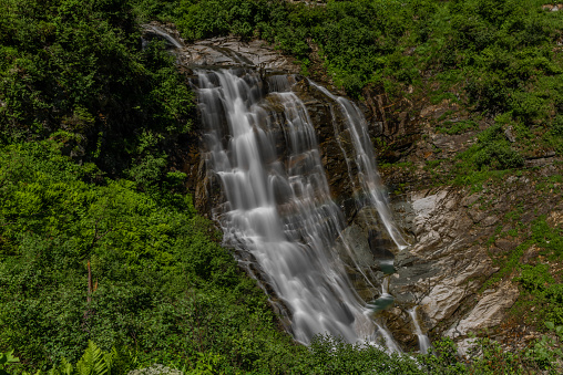 Schleierfall waterfall near Sportgastein place between big color summer mountains