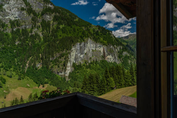 istock Summer valley with Grossarler Ache small river and blue cloudy sky 1328174033