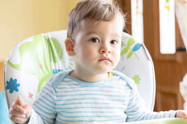 istock little cute baby eating breakfast 1328174589