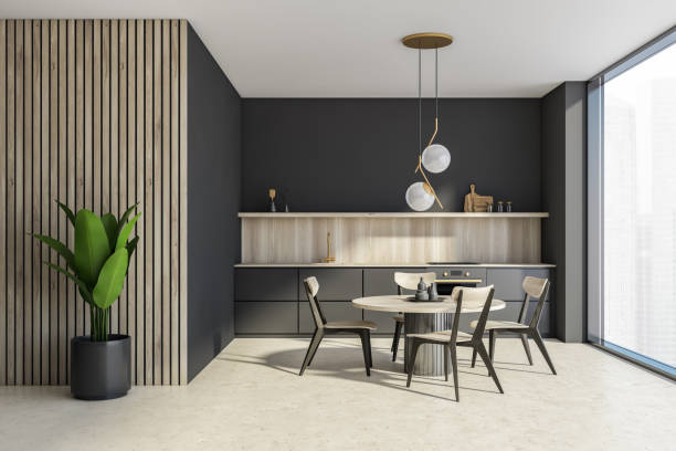 istock Grey and wooden kitchen interior with table and chairs, concrete floor 1328175424