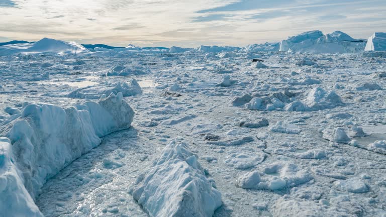 Drone video of Iceberg and ice from glacier in arctic nature landscape on Greenland. Aerial video drone video of icebergs in Ilulissat icefjord. Affected by climate change and global warming.