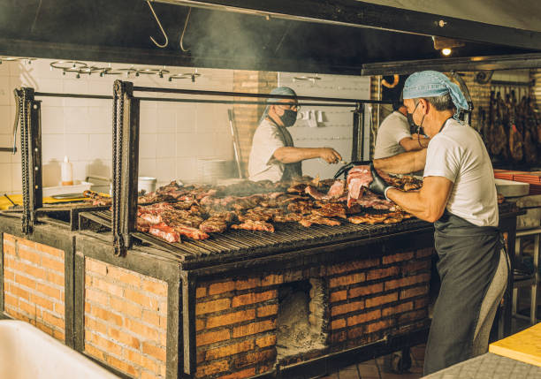 istock Chefs in Face Mask Cooking Meat 1328178027
