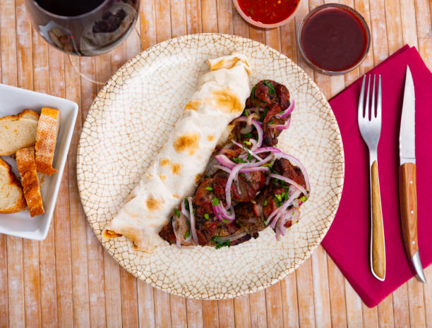 istock Grilled pork meat shashlik with sliced onion 1328178849