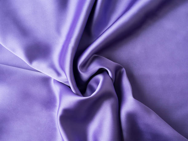 istock Purple satin texture background with waves and crease 1328179597