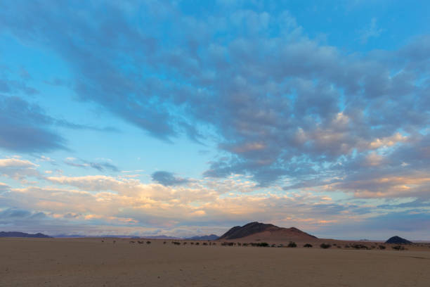 istock Sunrise color clouds different colors in Namib Desert 1328181114