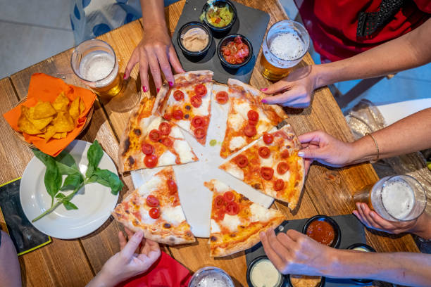 istock closeup of pizza slices on the table top view 1328181135