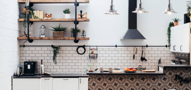 istock Modern new light interior of kitchen with white furniture. 1328182949