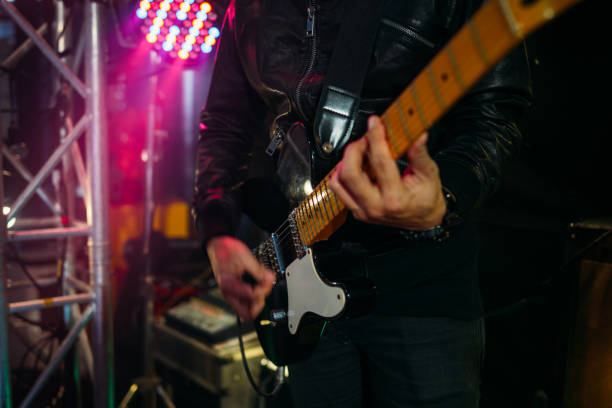 istock Music band performing on stage in night club 1328190167